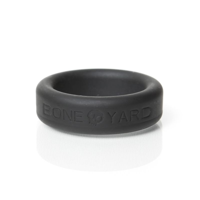 Boneyard 30mm black silicone cock ring, low front view of Boneyard lettering and skull motif