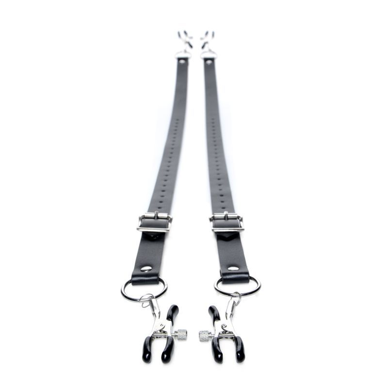 Pair of black Spread XL straps laid lengthways, showing buckle adjustments, rings and clamps at both ends