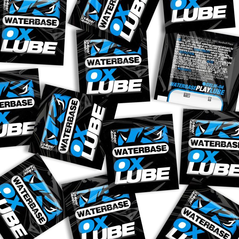 Blue and black OxBalls Waterbase OXLube 4ml sachets with front designs and one reverse label