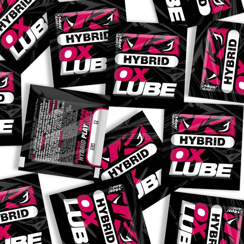 Pink and black OxBalls Hybrid OXLube 4ml sachets, showing front designs and one reverse label