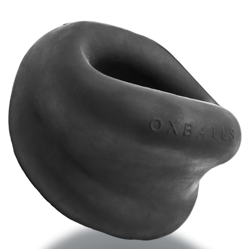 OxBalls Meat Night cock ring in black, angled view showing thick scoop-shaped lip