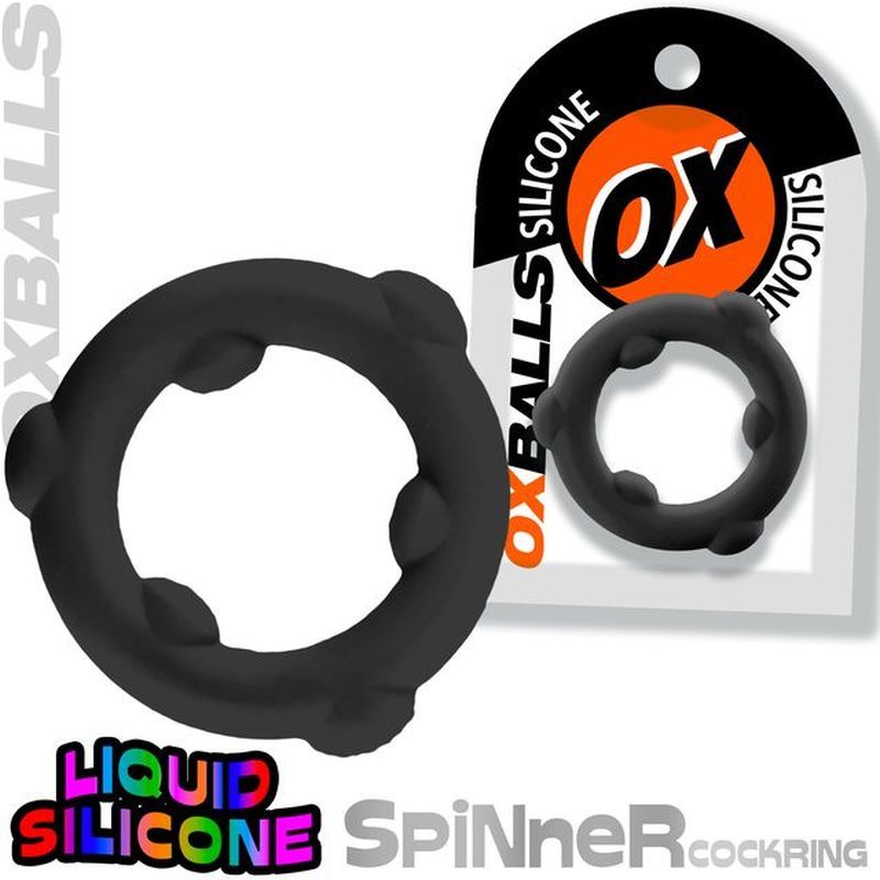 OxBalls Spinner black silicone cock ring beside a retail packaging example