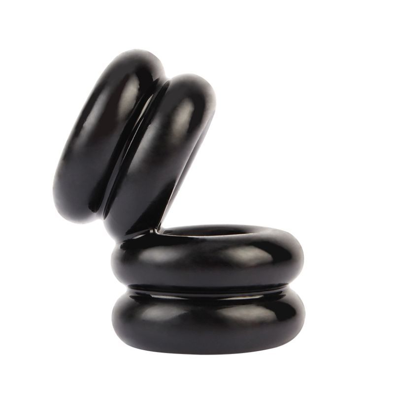 Side view of the black GK Power Double Stacked Dual Pleasure cock and ball ring showing double bands on both linked openings