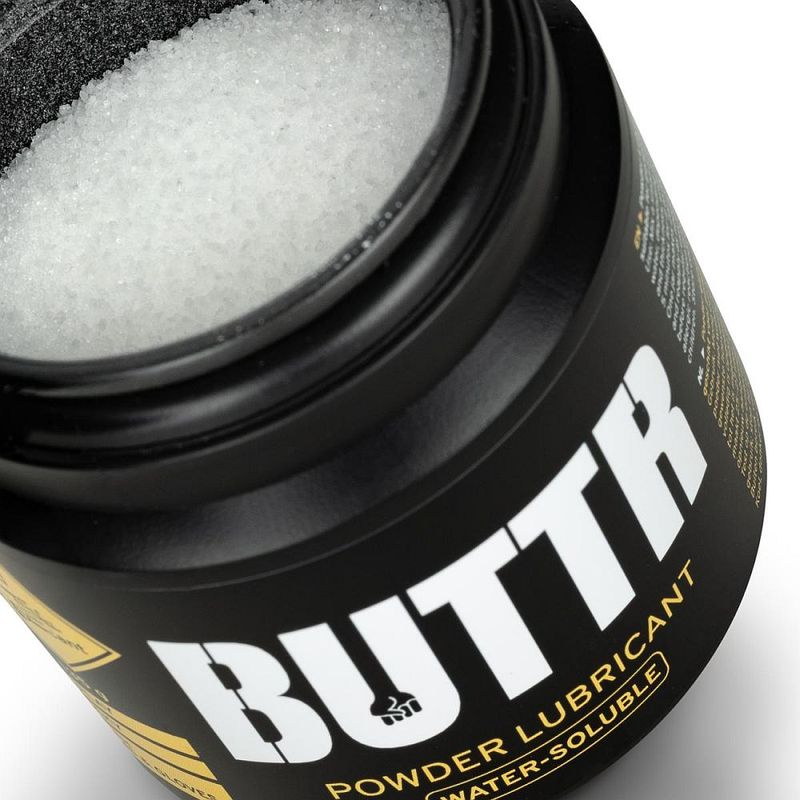 Open BUTTR Powder Lube tub showing the white lubricant powder inside