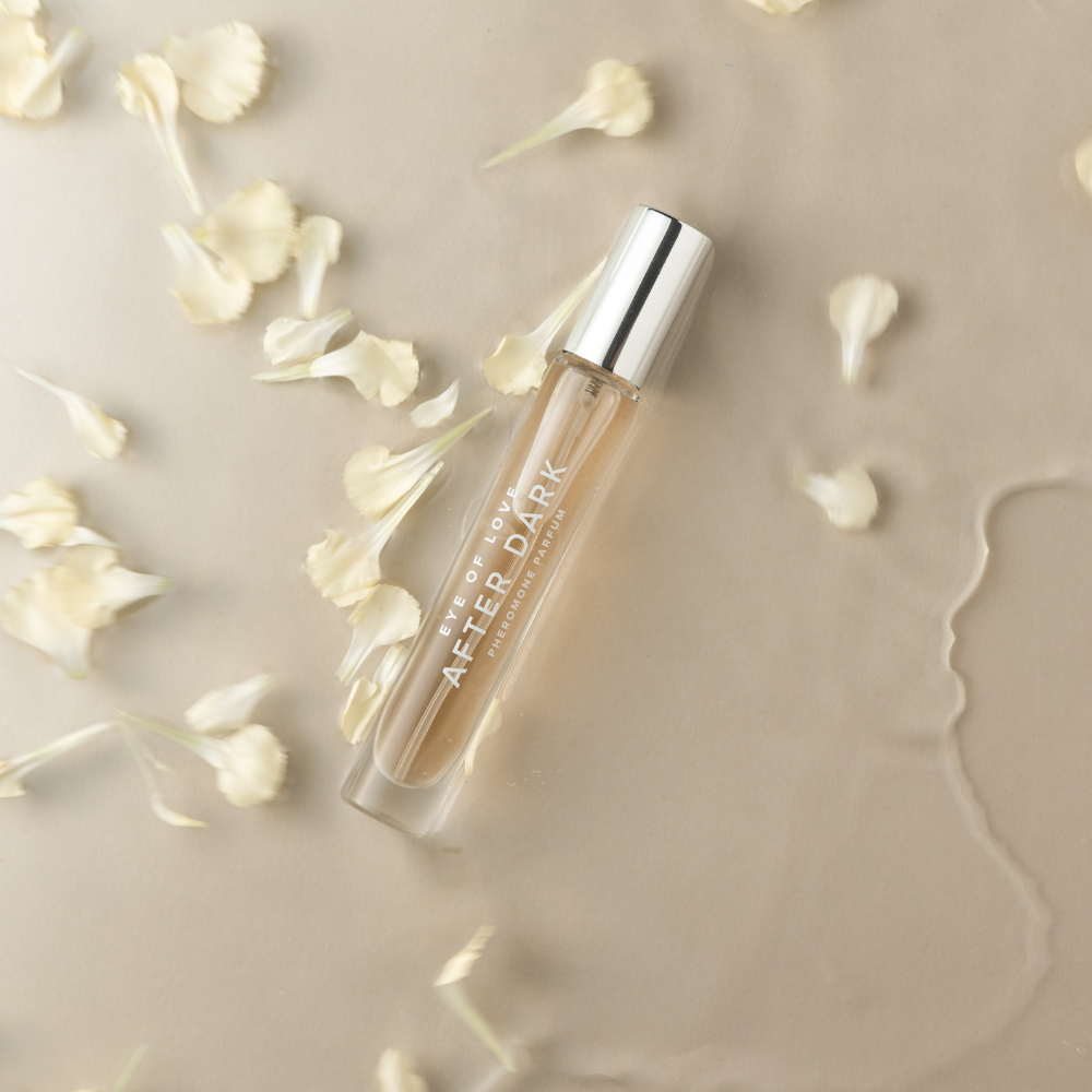 Eye of Love After Dark perfume 10ml travel spray styled with flowers