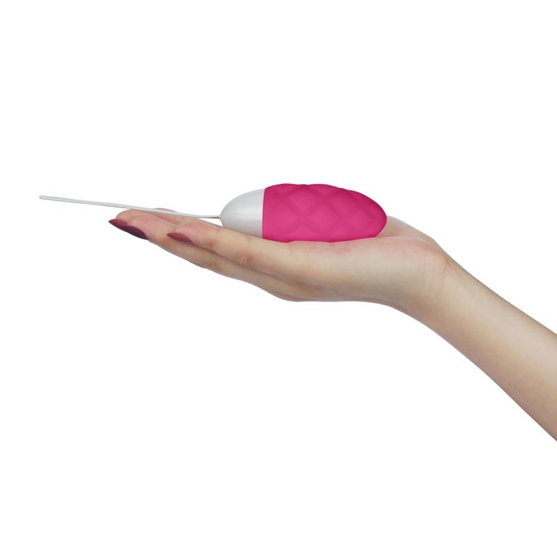Lovetoy iJoy pink diamond-textured rechargeable egg resting in a hand