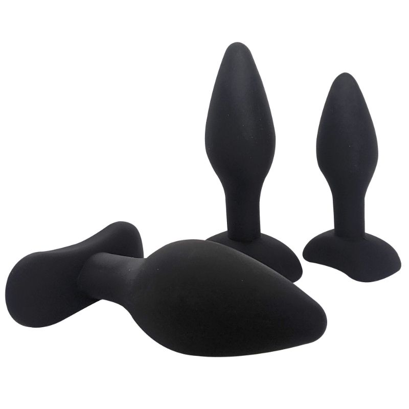 Three Brutus black silicone anal plugs showing their graduated sizes, tapered tips and broad bases