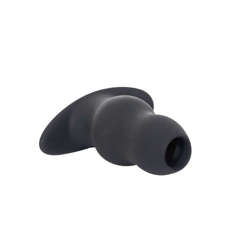 Angled view of the black Brutus Ergo Bum XXL silicone tunnel plug showing two rounded sections, the hollow opening and broad curved base