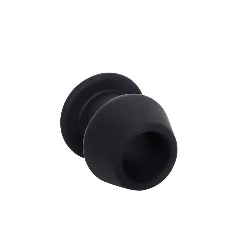 Angled view through the open centre of the Brutus Gobbler Small black silicone tunnel plug