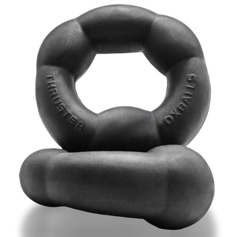 OxBalls Thruster Night cock ring in black, two display views showing contoured ring and thicker underside lobe