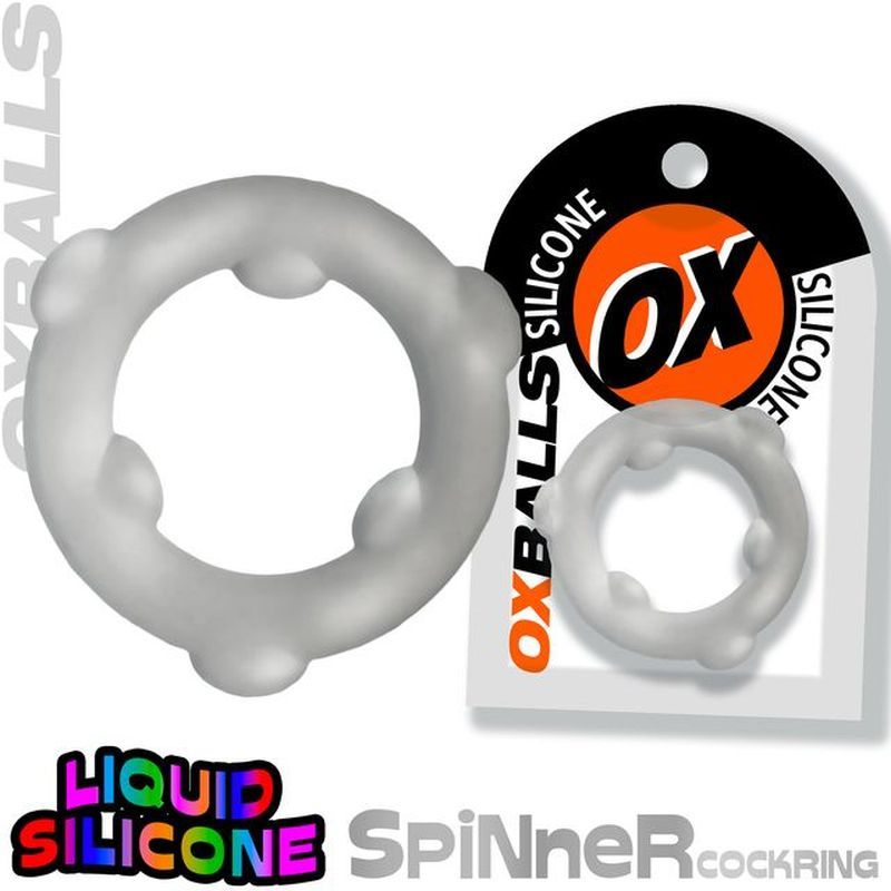 OxBalls Spinner translucent clear silicone cock ring beside a retail packaging example