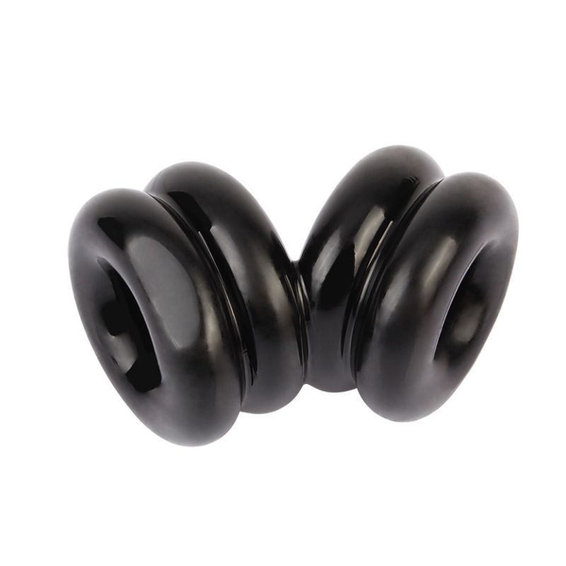 Angled view of the black GK Power Double Stacked Dual Pleasure ring showing its two linked openings and rounded bands