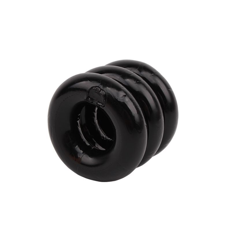 Angled view of the black GK Power Triad Cock Ring showing its rounded stacked profile and open centre