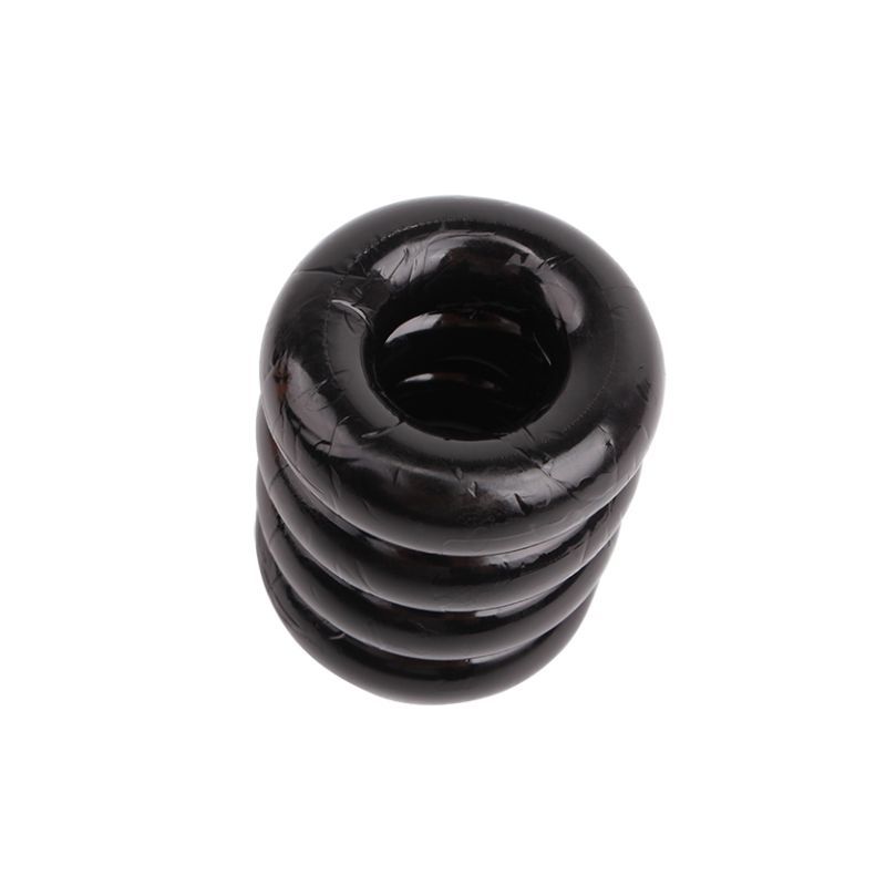 Upright angled view of the black GK Power Quadplay Cock Ring showing its stacked bands and central opening