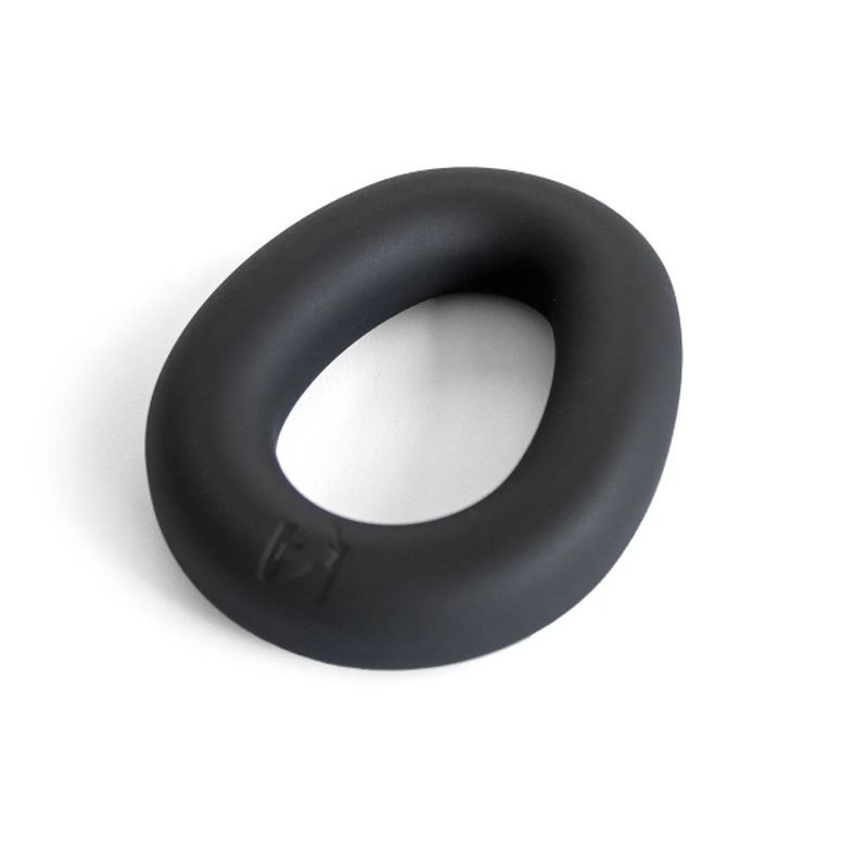 Angled view of the black Brutus Hypersoft Ergo silicone cock ring showing its broad curved band