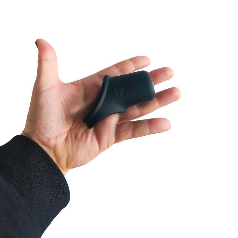 Brutus Shaft Hugger resting across a hand to show its broad silicone wrap