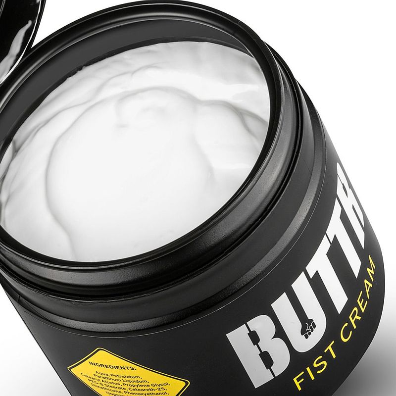 Open BUTTR Fisting Cream pot showing the thick white creamy lubricant texture