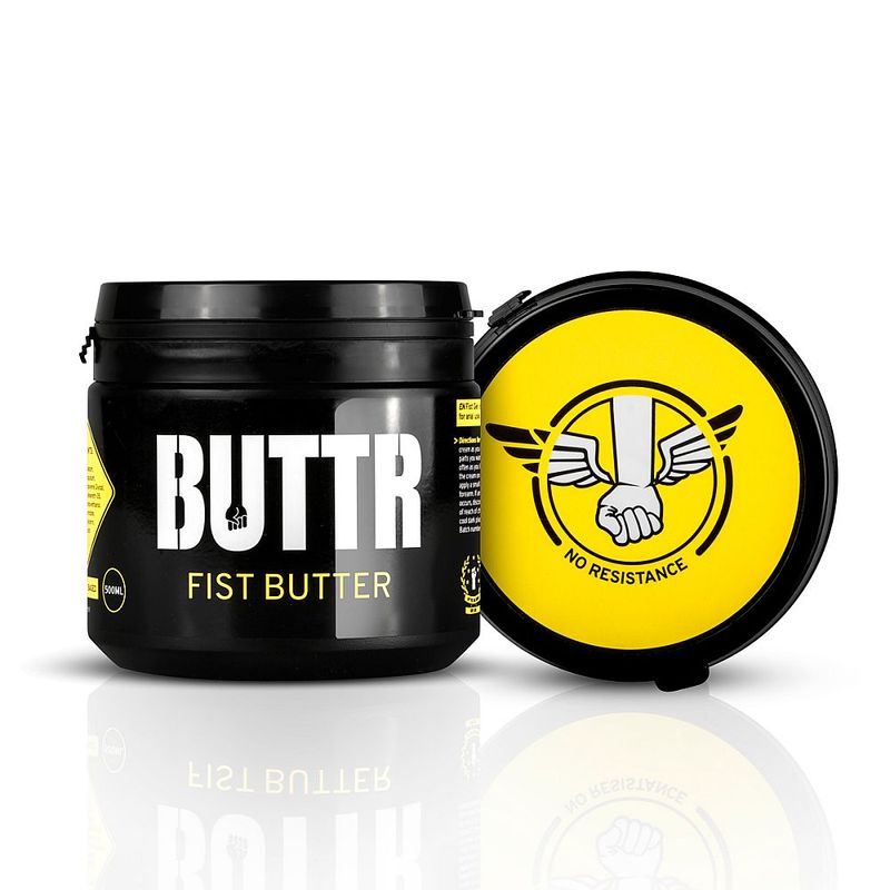 BUTTR Fist Butter 500ml black tub with lid beside it, showing the yellow winged-fist design
