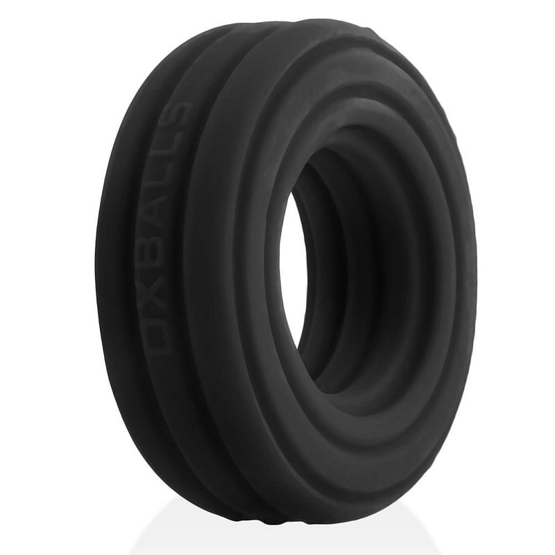 Black Hunkyjunk Roto cock ring, angled view of the layered grooved profile