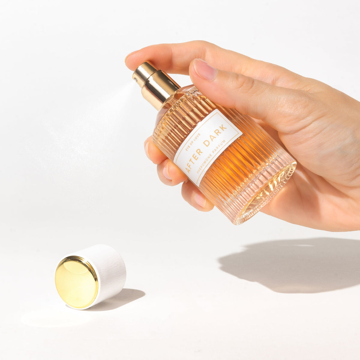 Eye of Love After Dark perfume 50ml spray shown in a hand